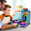 A father and son are playing an electronic arcade basketball game. Produktbild-Vorschau