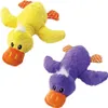 Two plush duck toys, one yellow and one purple, lying on a white background. Produktbild-Vorschau
