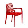 A red plastic chair with an intricate, web-like design on the backrest and seat. Produktbild-Vorschau