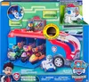 The image shows the packaging of a Paw Patrol Mission Cruiser toy, featuring the toy itself with multiple Paw Patrol characters and vehicles inside and around it. The packaging also includes promotional text and graphics. Produktbild-Vorschau