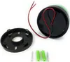 A green LED signal light with its mounting base and screws on a white background. Produktbild-Vorschau
