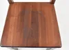 A close-up overhead view of the wooden seat of a chair. Produktbild-Vorschau
