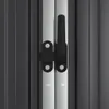 A close-up view of a black handle and latch mechanism on a silver metal door frame, with ribbed gray panels on either side. Náhled obrázku produktu