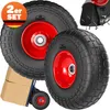 Two large black wheels with red rims are shown, with a smaller wheel and a hand truck with boxes in the background. Produktbild-Vorschau