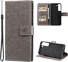A collage of images showing a grey flip phone case with a mandala design, its interior card slots, and the phone holder part.