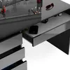 A close-up view of a modern vanity table with makeup and accessories. Produktbild-Vorschau