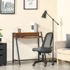 A home office setup with a desk, chair, and floor lamp. Produktbild-Vorschau