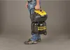 A person is holding a portable air compressor. Náhled obrázku produktu