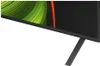 A close-up of the bottom corner of a television screen and its stand. Produktbild-Vorschau
