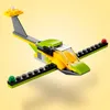 A LEGO Creator helicopter model is shown from a slightly elevated, diagonal angle against a plain, light yellow background. Anteprima dell’immagine prodotto