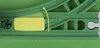 A close-up view of a green toy train track with a yellow piece highlighted by a curved arrow indicating movement. Podgląd zdjęcia produktu