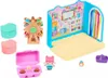 A collection of small toys, including a playhouse, a Ferris wheel, figurines, and accessories, arranged on a white background. Produktbild-Vorschau