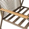 Close-up view of the armrest and woven back of a chair. Podgląd zdjęcia produktu
