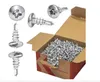 A collection of self-drilling screws in a cardboard box, with individual screws displayed on the left. Anteprima dell’immagine prodotto