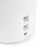 A close-up view of the side of a white electronic device, showing ports and a button. Produktbild-Vorschau