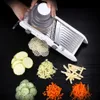 A mandoline slicer is shown with various vegetables cut into different shapes and sizes. Náhled obrázku produktu
