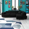 A black sectional sofa is shown in a room with turquoise walls and a geometric rug.