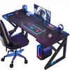 A gaming desk setup with a chair, computer, monitor, keyboard, and accessories. Produktbild-Vorschau