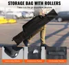 A person is walking with a black storage bag with rollers. Podgląd zdjęcia produktu
