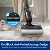 A person is using a wet dry vacuum cleaner on a tiled floor, with a dog lying nearby. The image highlights the vacuum's anti-tangle design. Produktbild-Vorschau