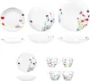 A collection of white porcelain dinnerware with a floral pattern, including plates, bowls, and cups, arranged on a white background. Produktbild-Vorschau