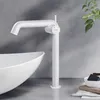 A white faucet is shown next to a white sink in a bathroom setting. Podgląd zdjęcia produktu