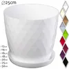 A white plastic plant pot with a geometric pattern and a matching saucer, shown on a white background. A color swatch palette is visible on the right side of the image. Podgląd zdjęcia produktu
