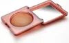 An open compact with bronzer and a mirror. Produktbild-Vorschau