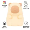 A cute, beige bear-shaped night light with brown accents, surrounded by icons and text describing its features. Náhľad obrázku produktu