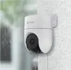 A white dome security camera is mounted on a textured wall, with rain falling in the background. Anteprima dell’immagine prodotto