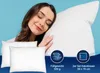 A woman sleeping peacefully on a pillow, with two pillows in the foreground. Produktbild-Vorschau