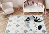 A child's bedroom with a rug, bed, and chair. Podgląd zdjęcia produktu