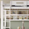 A close-up view of a white bunk bed with shelves filled with books and a decorative deer. A stuffed giraffe is visible in the foreground. Produktbild-Vorschau