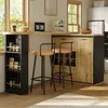 A modern kitchen or dining area with a bar counter, stools, and storage units. Produktbild-Vorschau
