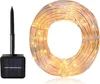 A coiled string of solar-powered LED lights and a separate solar panel with a stake. Produktbild-Vorschau