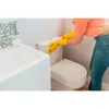 A person wearing yellow gloves cleans a toilet in a bathroom. Produktbild-Vorschau