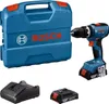 A Bosch cordless drill, its case, a battery charger, and a spare battery are displayed against a white background. Náhled obrázku produktu