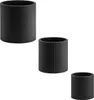 Three black cylindrical planters of varying sizes are arranged diagonally on a white background. Produktbild-Vorschau