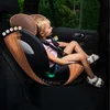 A young child is sitting in a car seat in the back seat of a car. Produktbild-Vorschau