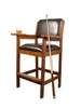 A billiards player's chair with a drink and cue stick. Produktbild-Vorschau
