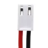A close-up view of a white electrical connector with two metal terminals, attached to red and black wires. Produktbild-Vorschau