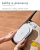 Hands holding a white electronic device over an open suitcase. Náhled obrázku produktu