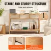 A light wood console table with three rattan-fronted drawers is displayed in a living room setting, with decorative items on and around it. Text overlays highlight features like 'STABLE AND STURDY STRUCTURE' and 'Smooth Drawer Tracks'. Produktbild-Vorschau