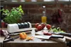 A knife sharpener on a wooden table with fresh ingredients. Produktbild-Vorschau