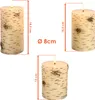 Three LED candles with a birch wood appearance are shown with dimensions indicated by measurement lines and text. Produktbild-Vorschau