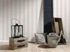 A still life arrangement of home decor items against a striped wallpaper. Produktbild-Vorschau