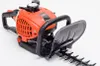 A close-up studio shot of a gasoline-powered hedge trimmer against a white background. Náhľad obrázku produktu