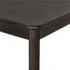 A close-up view of the corner of a dark wood table, showing the rounded edge and a table leg. Produktbild-Vorschau