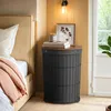A bedroom scene with a bed, nightstand, and wall lamp. Produktbild-Vorschau