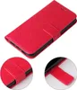 A red floral patterned flip phone case shown from a diagonal angle. Produktbild-Vorschau